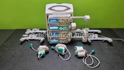 4 x B.Braun Perfusor Space Syringe Pumps (All Power Up) with 1 x B.Braun Space Station, 4 x Pole Clamps and 4 x Power Supplies (3 x Untested Power Supplies) *SN 065985 / 368005 / 368750 / 367975 / 368714*