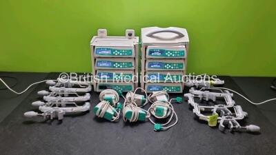 8 x B.Braun Infusomat Space Infusion Pumps (7 x Power Up) with 2 x B.Braun Space Station, 8 x Pole Clamps and 8 x Power Supplies (7 x Untested Power Supplies) *SN 438012 / na / 437945 / 438011 / 437091 / 437913 / 437000 / 437943*