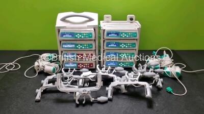 8 x B.Braun Infusomat Space Syringe Pumps (All Power Up) with 2 x B.Braun Space Station, 8 x Pole Clamps and 8 x Power Supplies (7 x Untested Power Supplies) *SN 437853 / 438032 / 437984 / 437820 / 437160 / 437029 / 437959 / 438014*