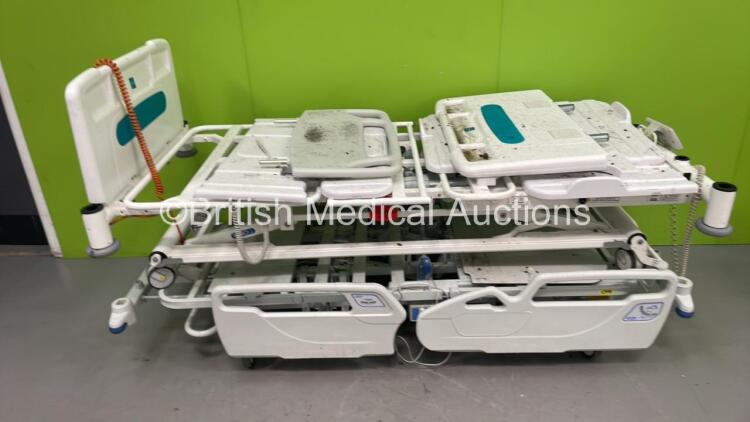 1 x Huntleigh Electric Hospital Bed with Controller and 1 x Sidhil Electric Hospital Bed with Controller