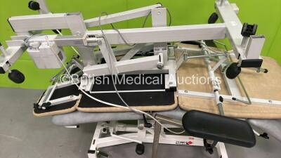 1 x MediPlinth Electric 3 Way Patient Examination Couch with Controller and 1 x Plinth 2000 Electric Patient Examination Couch with Controller (Both Power Up - 1 x Damaged Wheel - See Pictures) *S/N 503CDW0308472* - 3