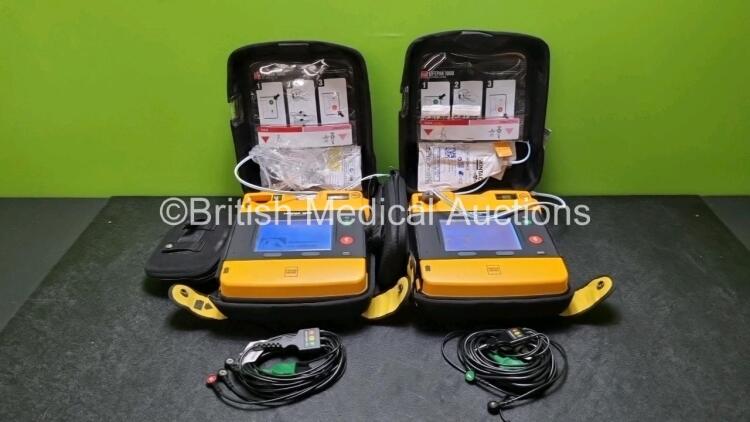 2 x Medtronic Physio Control Lifepak 1000 Defibrillators *Mfd 2012 / 2018* (Both Power Up , 1 x with Crack In Casing - See Photo) with 2 x 3 Lead ECG Leads and 2 x Batteries *Install Before 2023 / 2024*