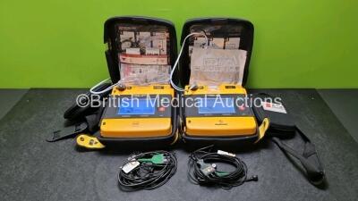 2 x Medtronic Physio Control Lifepak 1000 Defibrillators *Mfd 2011 / 2009* (Both Power Up) with 2 x 3 Lead ECG Leads and 2 x Batteries *Install Before 2023 / 2024*