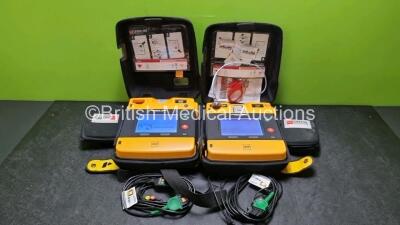 2 x Medtronic Physio Control Lifepak 1000 Defibrillators *Mfd 2014 / 2021* (Both Power Up) with 2 x 3 Lead ECG Leads and 2 x Batteries *Install Before 2023 / 2024*