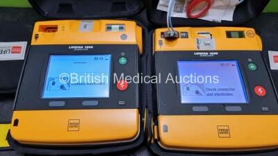 2 x Medtronic Physio Control Lifepak 1000 Defibrillators *Mfd 2014 / 2021* (Both Power Up) with 2 x 3 Lead ECG Leads and 2 x Batteries *Install Before 2023 / 2024* - 5