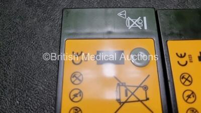 2 x Medtronic Physio Control Lifepak 1000 Defibrillators *Mfd 2014 / 2018* (Both Power Up Both with Crack In Casing - See Photos) with 2 x 3 Lead ECG Leads and 2 x Batteries *Install Before - 2024* - 5