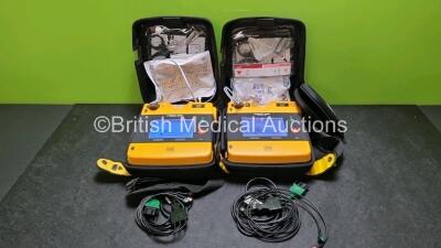 2 x Medtronic Physio Control Lifepak 1000 Defibrillators *Mfd 2012 / 2018* (Both Power Up, 1 x with Crack in Casing - See Photo) with 2 x 3 Lead ECG Leads and 2 x Batteries *Install Before - 2024*