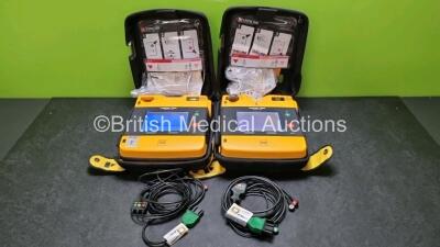 2 x Medtronic Physio Control Lifepak 1000 Defibrillators *Mfd - 2018* (Both Power Up, 1 x with Slight Crack In Casing - See Photo) with 2 x 3 Lead ECG Leads and 2 x Batteries *Install Before 2023 / 2024*