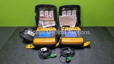 2 x Medtronic Physio Control Lifepak 1000 Defibrillators *Mfd 2012 / 2011* (Both Power Up) with 2 x 3 Lead ECG Leads and 2 x Batteries *Install Before 2022 / 2024*