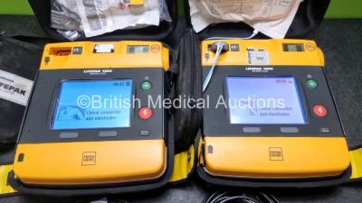 2 x Medtronic Physio Control Lifepak 1000 Defibrillators *Mfd 2012 / 2011* (Both Power Up) with 2 x 3 Lead ECG Leads and 2 x Batteries *Install Before 2022 / 2024* - 2