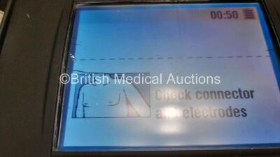 2 x Medtronic Physio Control Lifepak 1000 Defibrillators *Mfd 2012 / 2011* (Both Power Up) with 2 x 3 Lead ECG Leads and 2 x Batteries *Install Before 2022 / 2024* - 5