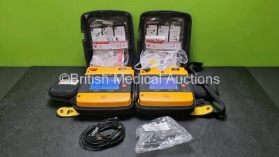 2 x Medtronic Physio Control Lifepak 1000 Defibrillators *Mfd 2019 / 2018* (Both Power Up) with 2 x 3 Lead ECG Leads and 2 x Batteries *Install Before 2024*