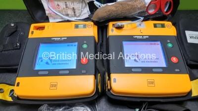 2 x Medtronic Physio Control Lifepak 1000 Defibrillators *Mfd 2016 / 2018* (Both Power Up) with 2 x 3 Lead ECG Leads and 2 x Batteries *Install Before 2023 / 2024* - 2