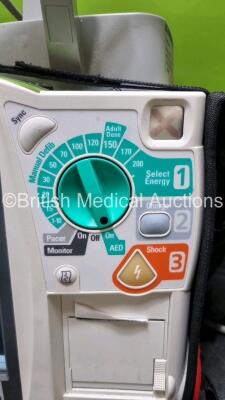 Philips Heartstart MRx Defibrillator with External Hard Paddle (Powers Up) Including Pacer, ECG, BP1, BP2, Temp, SpO2, NIBP, CO2 and Printer Options with Philips M3539A Module, Philips M3538A Battery, Philips M3725A Test Load, SpO2 Finger Sensor, Paddle - 3