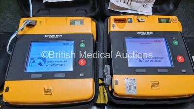 2 x Medtronic Physio Control Lifepak 1000 Defibrillators *Mfd 2012 / 2018* (Both Power Up Both with Slight Crack In Casing - See Photos) with 2 x 3 Lead ECG Leads and 2 x Batteries *Install Before 2027 / 2024* - 2