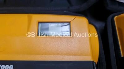 2 x Medtronic Physio Control Lifepak 1000 Defibrillators *Mfd 2012 / 2018* (Both Power Up Both with Slight Crack In Casing - See Photos) with 2 x 3 Lead ECG Leads and 2 x Batteries *Install Before 2027 / 2024* - 3