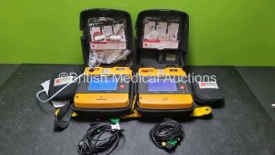 2 x Medtronic Physio Control Lifepak 1000 Defibrillators *Mfd 2012 / 2018* (Both Power Up Both with Slight Crack In Casing - See Photos) with 2 x 3 Lead ECG Leads and 2 x Batteries *Install Before 2024*