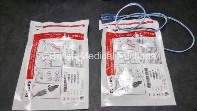 2 x Philips Heartstart FR2+ Defibrillators (Both Power Up) with 2 x Batteries and 2 x Electrode Packs - 4