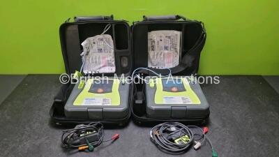 2 x Zoll AED PRO Defibrillators (Both Power Up) with 2 x 3 Lead ECG Lead and 2 x In Date Electrode Packs