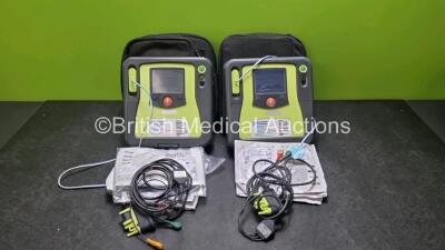 2 x Zoll AED PRO Defibrillators (Both Power Up, 1 x Damaged Screen - See Photo) with 2 x 3 Lead ECG Lead and 4 x In Date Electrode Packs