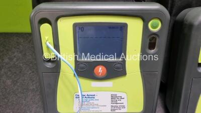 2 x Zoll AED PRO Defibrillators (Both Power Up, 1 x Damaged Screen - See Photo) with 2 x 3 Lead ECG Lead and 4 x In Date Electrode Packs - 2