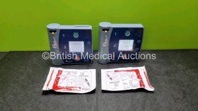 2 x Philips Heartstart FR2+ Defibrillators (Both Power Up) with 2 x Philips M3863A Batteries and 2 x Electrode Packs