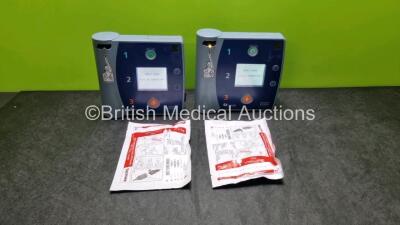 2 x Philips Heartstart FR2+ Defibrillators (Both Power Up) with 2 x Philips M3863A Batteries *Install Before - 2021 / 2019* and 2 x Electrode Packs