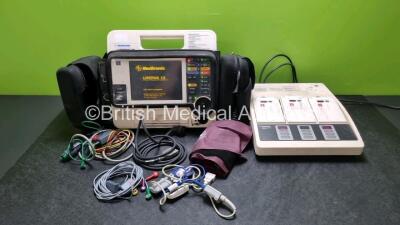 Job Lot Including Medtronic Lifepak 12 Biphasic Defibrillator P/N VLP12-02003264 (Powers Up, Damage to Casing / Paddle Lead Connection Broken - See Photos) Including ECG and SpO2 Options with 2 Batteries. 1 x 6 Lead ECG Lead. 1 x 4 Lead ECG Lead, 1 x Padd