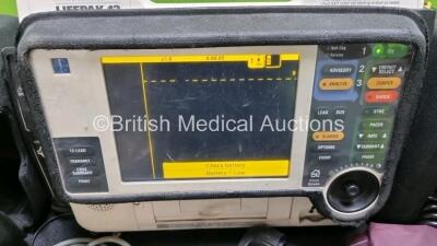 Job Lot Including Medtronic Lifepak 12 Biphasic Defibrillator P/N VLP12-02003264 (Powers Up, Damage to Casing / Paddle Lead Connection Broken - See Photos) Including ECG and SpO2 Options with 2 Batteries. 1 x 6 Lead ECG Lead. 1 x 4 Lead ECG Lead, 1 x Padd - 2