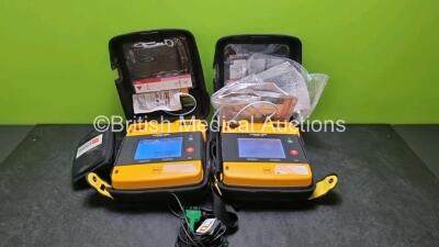 2 x Medtronic Physio Control Lifepak 1000 Defibrillators *Mfd 2015* (Both Power Up) with 2 x Batteries *Install Before 2021 / 2023* and 1 x 3 Lead ECG Lead *SN 43286655 / 44179430*