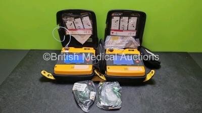 2 x Medtronic Physio Control Lifepak 1000 Defibrillators *Mfd 2015* (Both Power Up) with 2 x Batteries *Install Before 2021 / 2023* and 2 x 3 Lead ECG Lead *SN