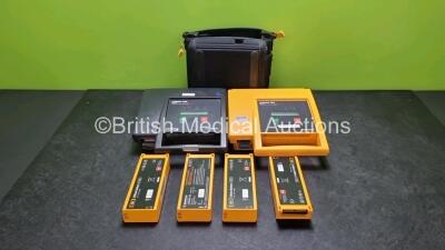 2 x Medtronic Physio Control Lifepak 500 Automated External Defibrillators (Both Power Up) with 6 x Batteries (4 x Untested) in 1 x Carry Case