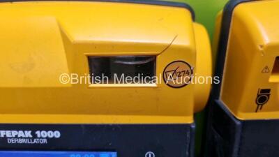 2 x Medtronic Physio Control Lifepak 1000 Defibrillators *Mfd 2016 / 2009* (Both Power Up with Stock Battery Stock Battery Not Included, Both with Damage to Casing - See Photo) - 3