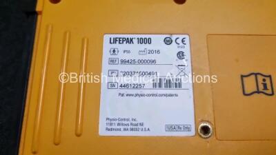 2 x Medtronic Physio Control Lifepak 1000 Defibrillators *Mfd 2016 / 2009* (Both Power Up with Stock Battery Stock Battery Not Included, Both with Damage to Casing - See Photo) - 5