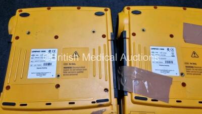 2 x Medtronic Physio Control Lifepak 1000 Defibrillators *Mfd 2009* (1 x No Power, 1 x Powers Up with Stock Battery Stock Battery Not Included, Both with Damage to Casing and Screen- See Photos) - 4