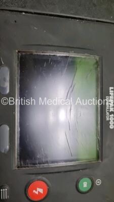 2 x Medtronic Physio Control Lifepak 1000 Defibrillators *Mfd 2009* (1 x No Power, 1 x Powers Up with Stock Battery Stock Battery Not Included, Both with Damage to Casing and Screen- See Photos) - 6