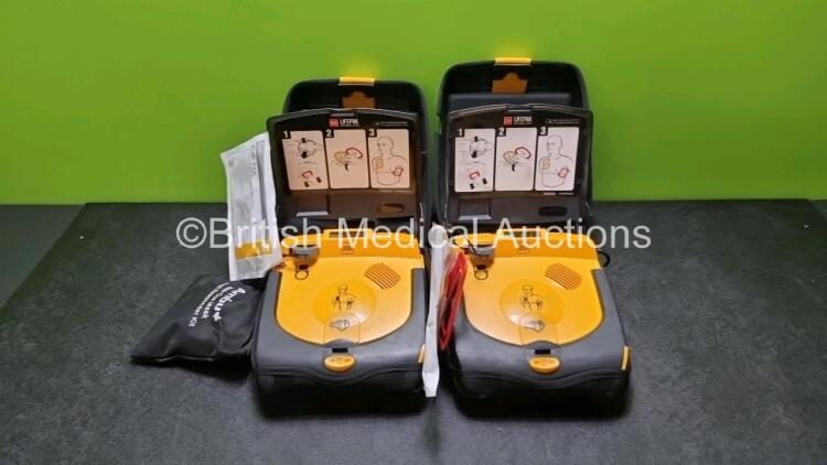 2 x Physio Control Lifepak CR Plus Defibrillators *Mfd 2016 / 2016* with 2 x Electrode Pads *Both in Date* and 2 x Res-Cue Masks in 2 x Carry Cases