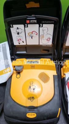 2 x Physio Control Lifepak CR Plus Defibrillators *Mfd 2016 / 2016* with 2 x Electrode Pads *Both in Date* and 2 x Res-Cue Masks in 2 x Carry Cases - 4