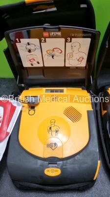 2 x Physio Control Lifepak CR Plus Defibrillators *Mfd 2016 / 2016* with 2 x Electrode Pads *Both in Date* and 2 x Res-Cue Masks in 2 x Carry Cases - 4