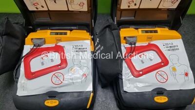 2 x Physio Control Lifepak CR Plus Defibrillators *Mfd 2016 / 2016* with 2 x Electrode Pads *Both in Date* and 2 x Res-Cue Masks in 2 x Carry Cases - 2