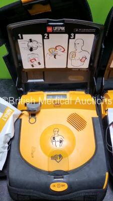 2 x Physio Control Lifepak CR Plus Defibrillators *Mfd 2015 / 2015* with 1 x Electrode Pads *Both in Date* and 2 x Res-Cue Masks in 2 x Carry Cases - 4