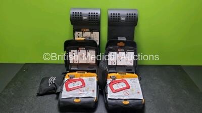 2 x Physio Control Lifepak CR Plus Defibrillators *Mfd 2016 / 2016* with 2 x Electrode Pads *Both in Date* 2 x Physio Control Defibrillator Bracket and 2 x Res-Cue Masks in 2 x Carry Cases