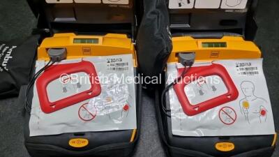 2 x Physio Control Lifepak CR Plus Defibrillators *Mfd 2016 / 2016* with 2 x Electrode Pads *Both in Date* 2 x Physio Control Defibrillator Bracket and 2 x Res-Cue Masks in 2 x Carry Cases - 2