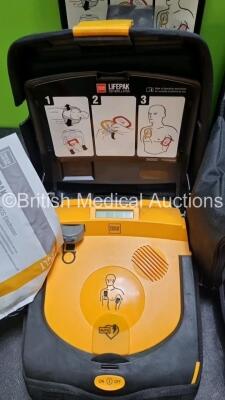 2 x Physio Control Lifepak CR Plus Defibrillators *Mfd 2016 / 2016* with 2 x Electrode Pads *Both in Date* 2 x Physio Control Defibrillator Bracket and 2 x Res-Cue Masks in 2 x Carry Cases - 4