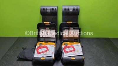 2 x Physio Control Lifepak CR Plus Defibrillators *Mfd 2016 / 2016* with 2 x Electrode Pads *Both in Date* 2 x Physio Control Defibrillator Bracket and 2 x Res-Cue Masks in 2 x Carry Cases