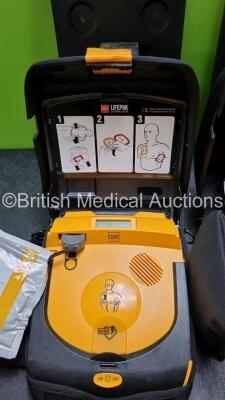 2 x Physio Control Lifepak CR Plus Defibrillators *Mfd 2016 / 2016* with 2 x Electrode Pads *Both in Date* 2 x Physio Control Defibrillator Bracket and 2 x Res-Cue Masks in 2 x Carry Cases - 4