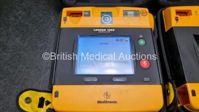 2 x Medtronic Physio Control Lifepak 1000 Defibrillators *Mfd 2019 / 2008* (Both Power Up with Stock Battery Stock Battery Not Included) - 2