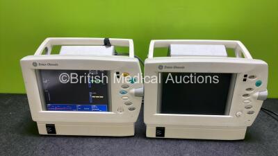 2 x Datex Ohmeda F-LM1.03 S/5 Patient Monitors Including ECG, SpO2, NIBP, T and Printer Options with 2 x Datex Ohmeda F-LBAT-01 Battery Packs (1 x Powers Up, 1 x No Power)