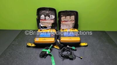 2 x Medtronic Physio Control Lifepak 1000 Defibrillators *Mfd 2008* (Both Power Up 1 x Slight Crack In Casing and Light Scratching On Screen - See Photo) with 2 x 3 Lead ECG Leads, 4 x In Date Electrode Packs and 2 x Batteries *Install Before 2024 / 2022*