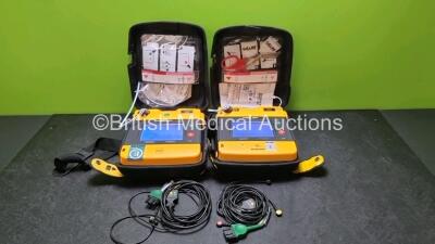 2 x Medtronic Physio Control Lifepak 1000 Defibrillators *Mfd 2009 / 2015* (Both Power Up, Both With Slight Crack in Casing - See Photos ) with 2 x 3 Lead ECG Leads, 3 x In Date Electrode Packs and 2 x Batteries *Install Before 2024 / 2027*